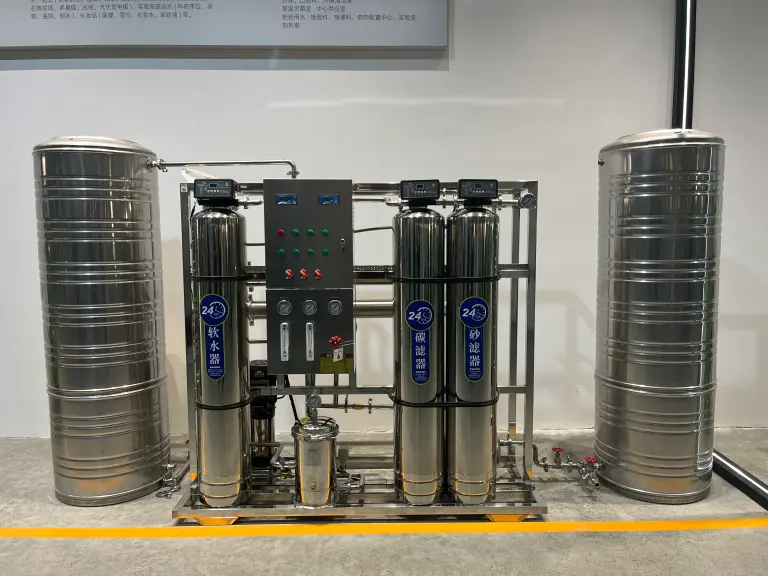 Stainless steel filter vessels, RO membrane rack and storage tanks on a packaged treatment system