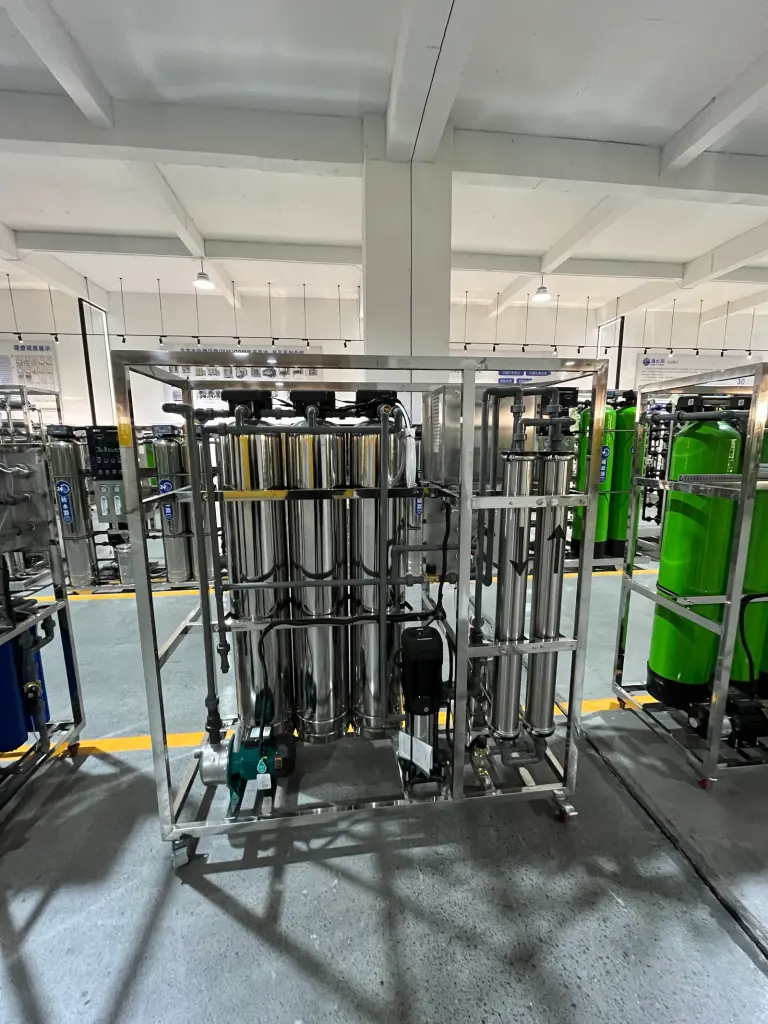 Stainless steel treatment vessels, process piping and pumps on a packaged industrial water treatment unit