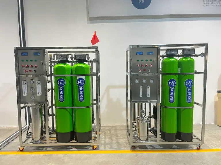 Two identical packaged water treatment units configured side by side in the workshop