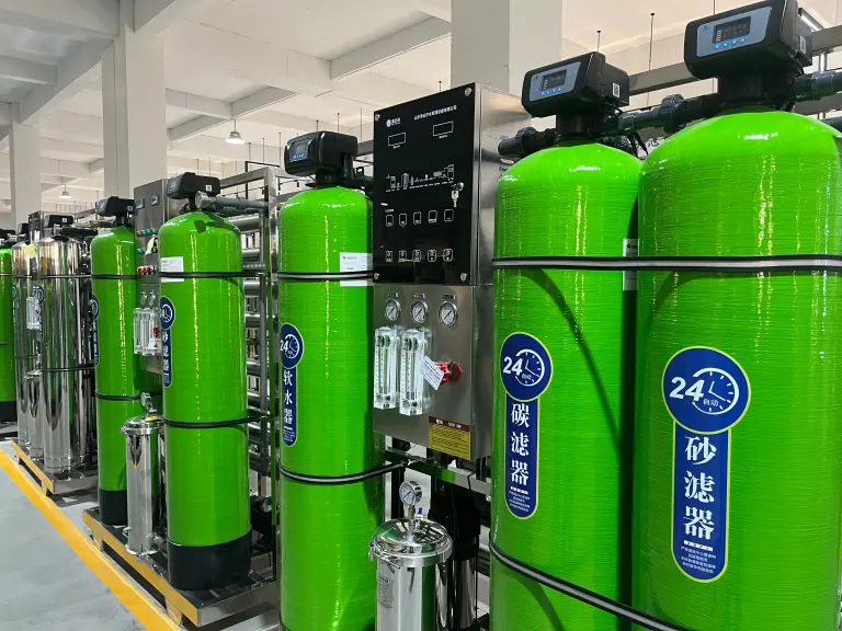 Pretreatment vessels and a control panel on a packaged water treatment system